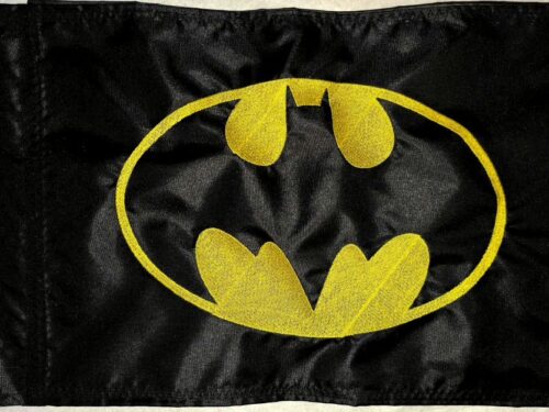 Batman safety flag with embroidered yellow bat emblem on black nylon rectangle with whip sleeve