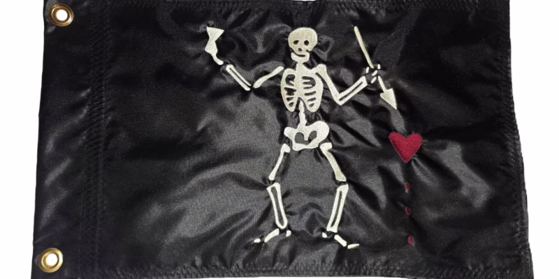 Close up of high density embroidered skeleton and heart on Blackbeard Pirate safety flag